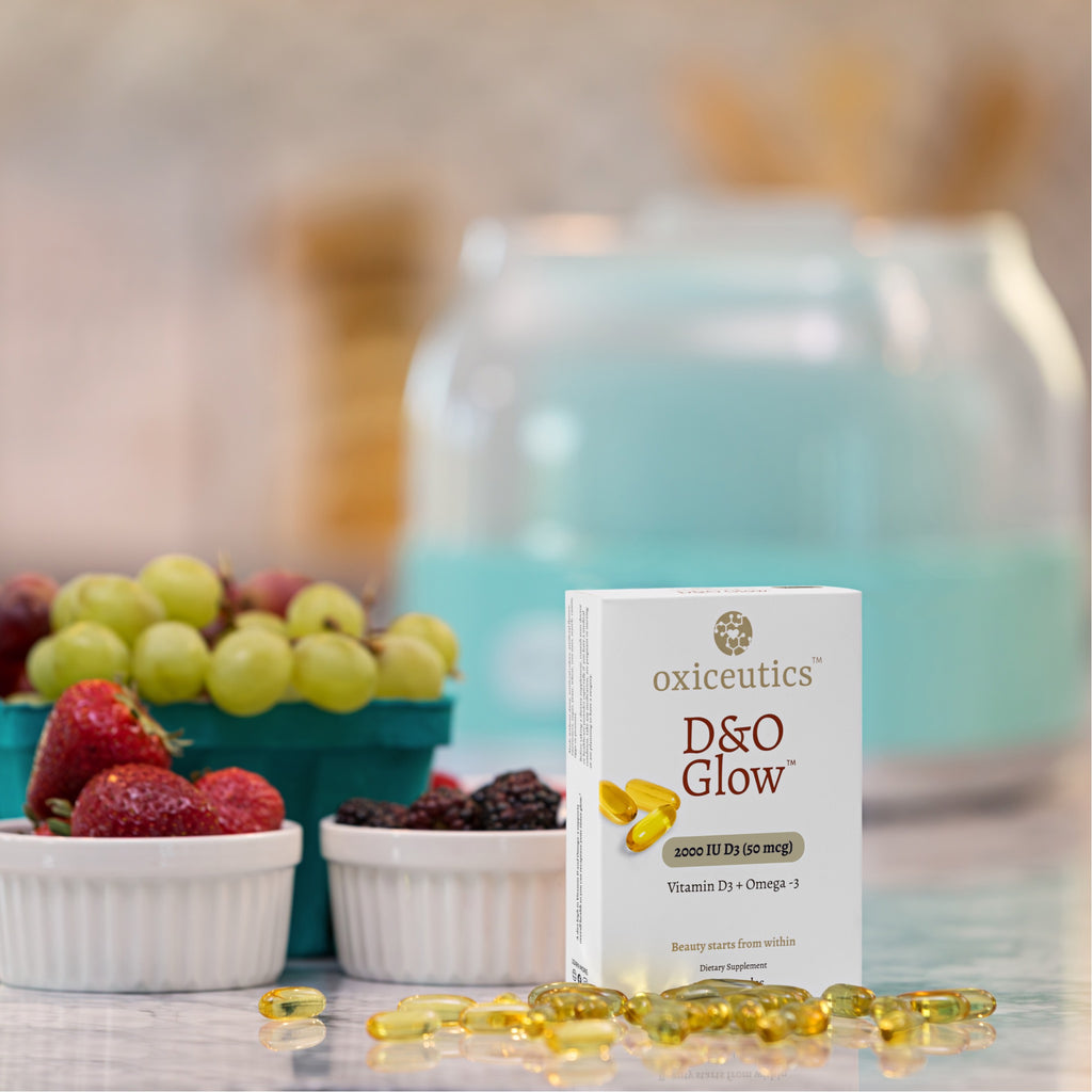 D&O Glow box beside fresh fruit, softgels on the counter (2000 IU)