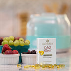 D&O Glow box beside fresh fruit, softgels on the counter (2000 IU)