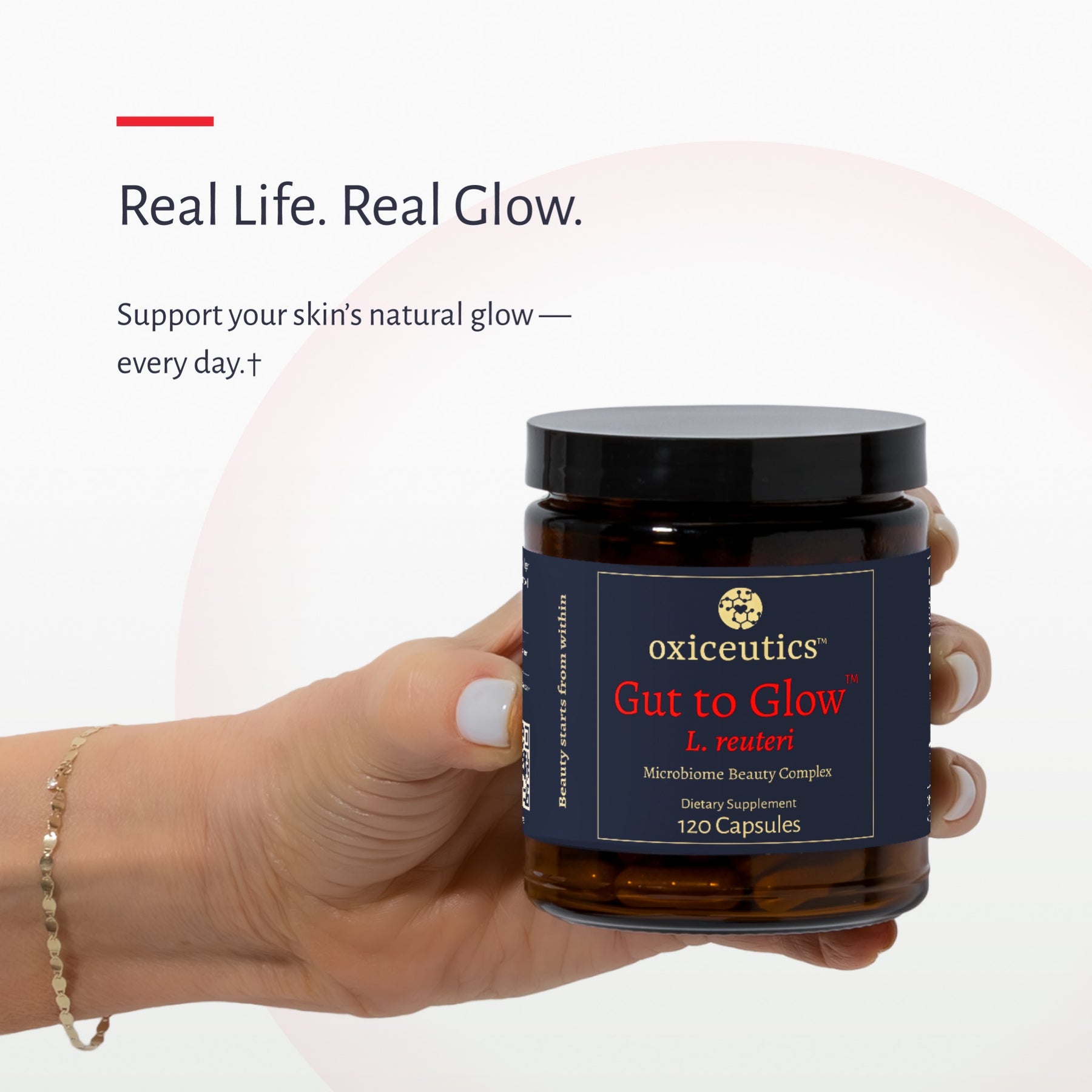 Hand holding a jar of Gut to Glow: Real Life. Real Glow.