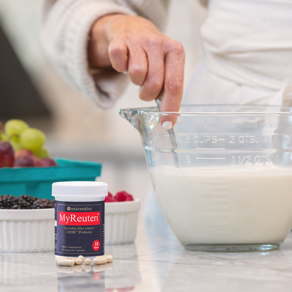 MyReuteri jar beside a measuring cup of milk (10 B)