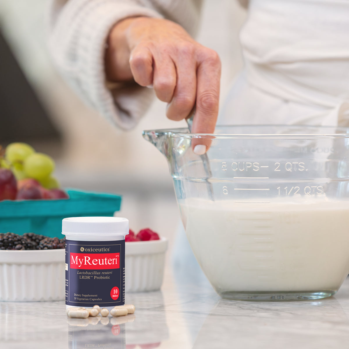 MyReuteri jar beside a measuring cup of milk (10 B)